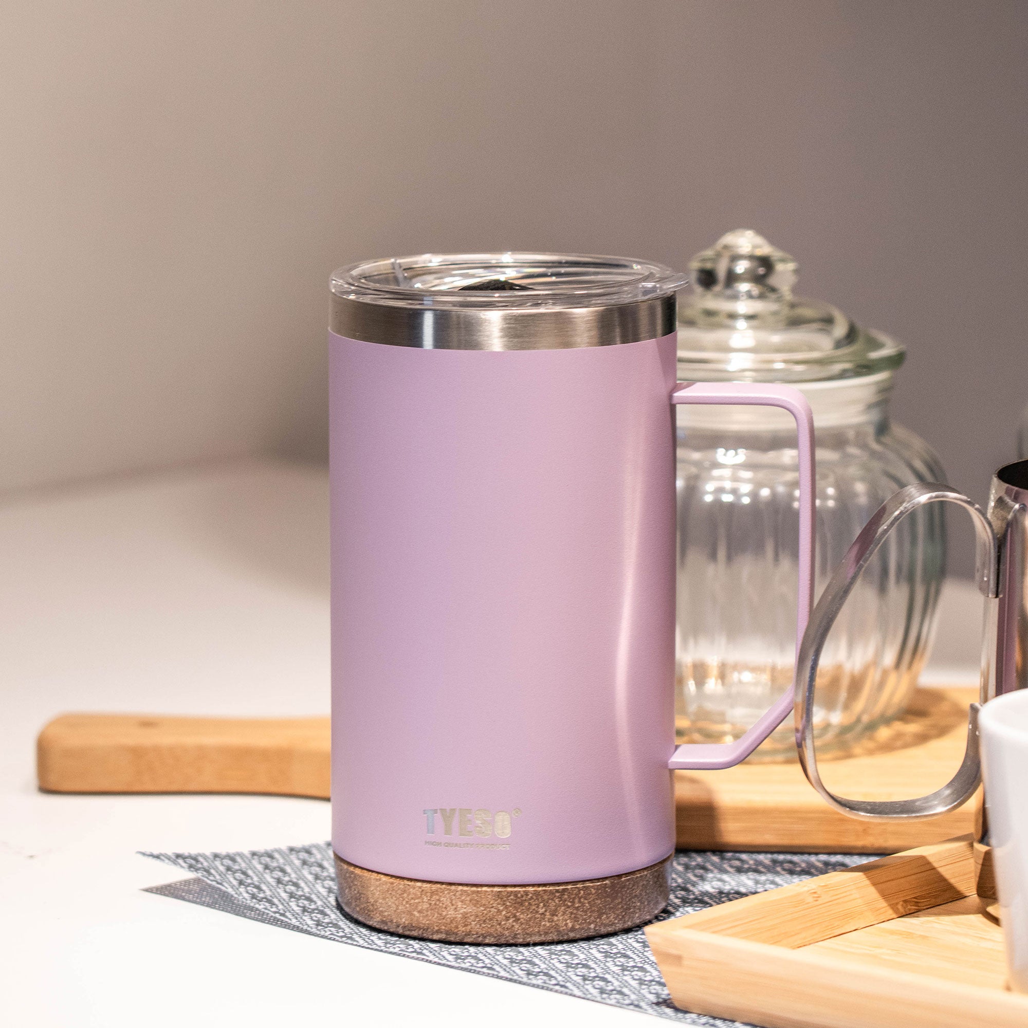 Purple 24 oz TYESO CASK insulated coffee mug in a quiet tea-time setting #color_purple