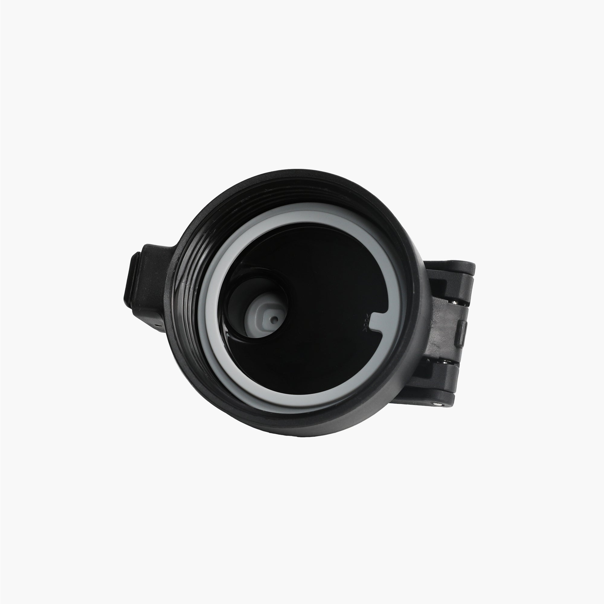 Angled view of black replacement lid for TYESO SURGE Sports Bottle with Safety Lock #color_black