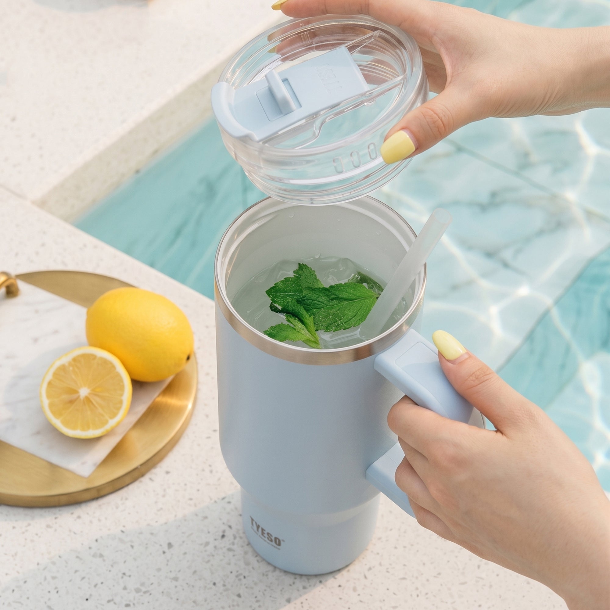 TYESO AURA POP ceramic-coated straw tumbler lifestyle image in Blue #color_blue
