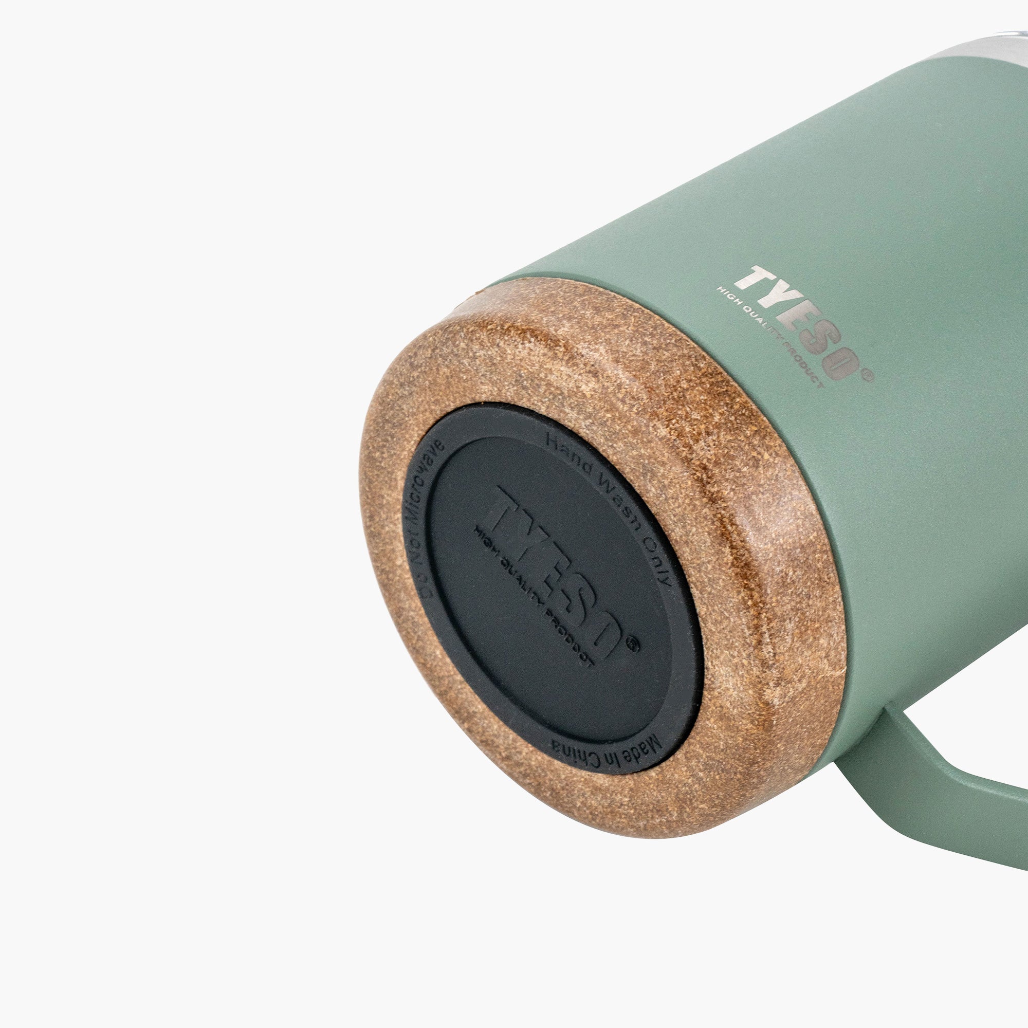 Close-up of the wood-look base on the green TYESO CASK coffee mug #color_green