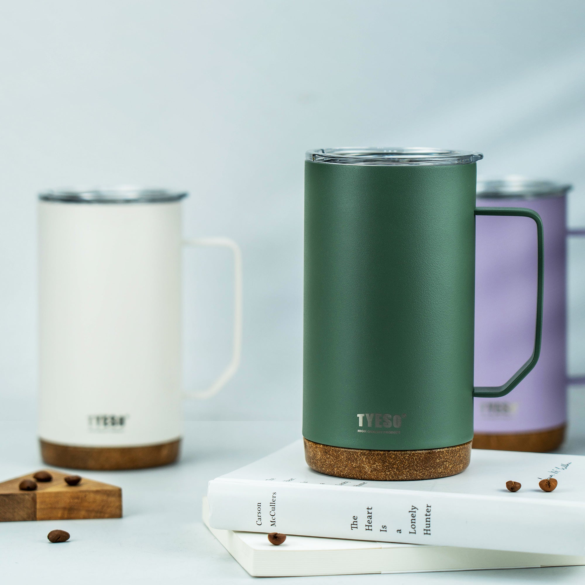 Green and white TYESO CASK coffee mugs arranged with a tray in a bright setting #color_green